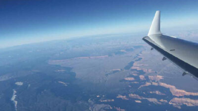 aircraft wing with earth below