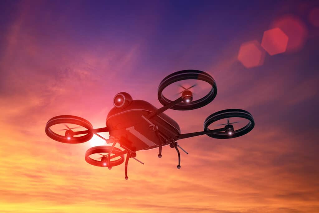 drone flying in the sky at sunset