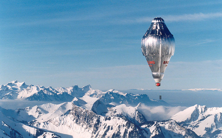 Bertrand Piccard and Brian Jones lift off from the Swiss alpine village of Chateau d’Oex in the Breitling Orbiter 3 balloon. After a 46,759-mile balloon flight which lasted 19 days, 21 hours and 55 minutes, the balloon achieves a non-stop round the world balloon flight. (Credit: Solar Impulse)