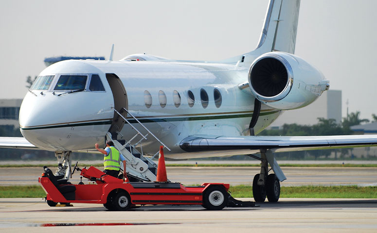 ground crew directing aircraft