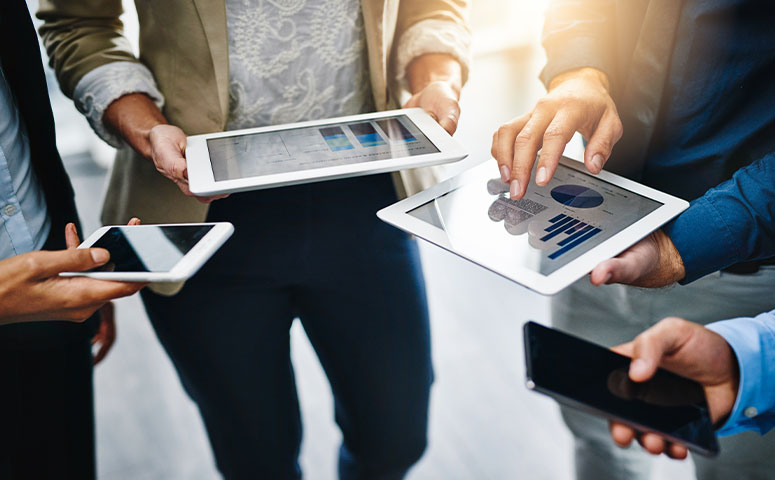 business team looking at mobile devices