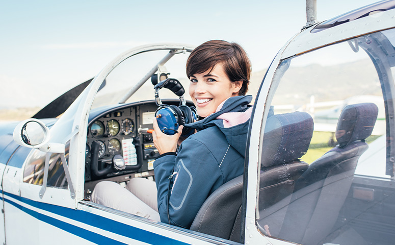 female pilot in the light aircraft cockpit